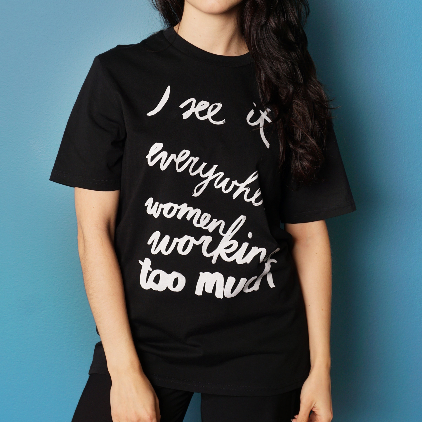 Eva Vēvere. Unisex T-Shirt "I see it everywhere women working too much"