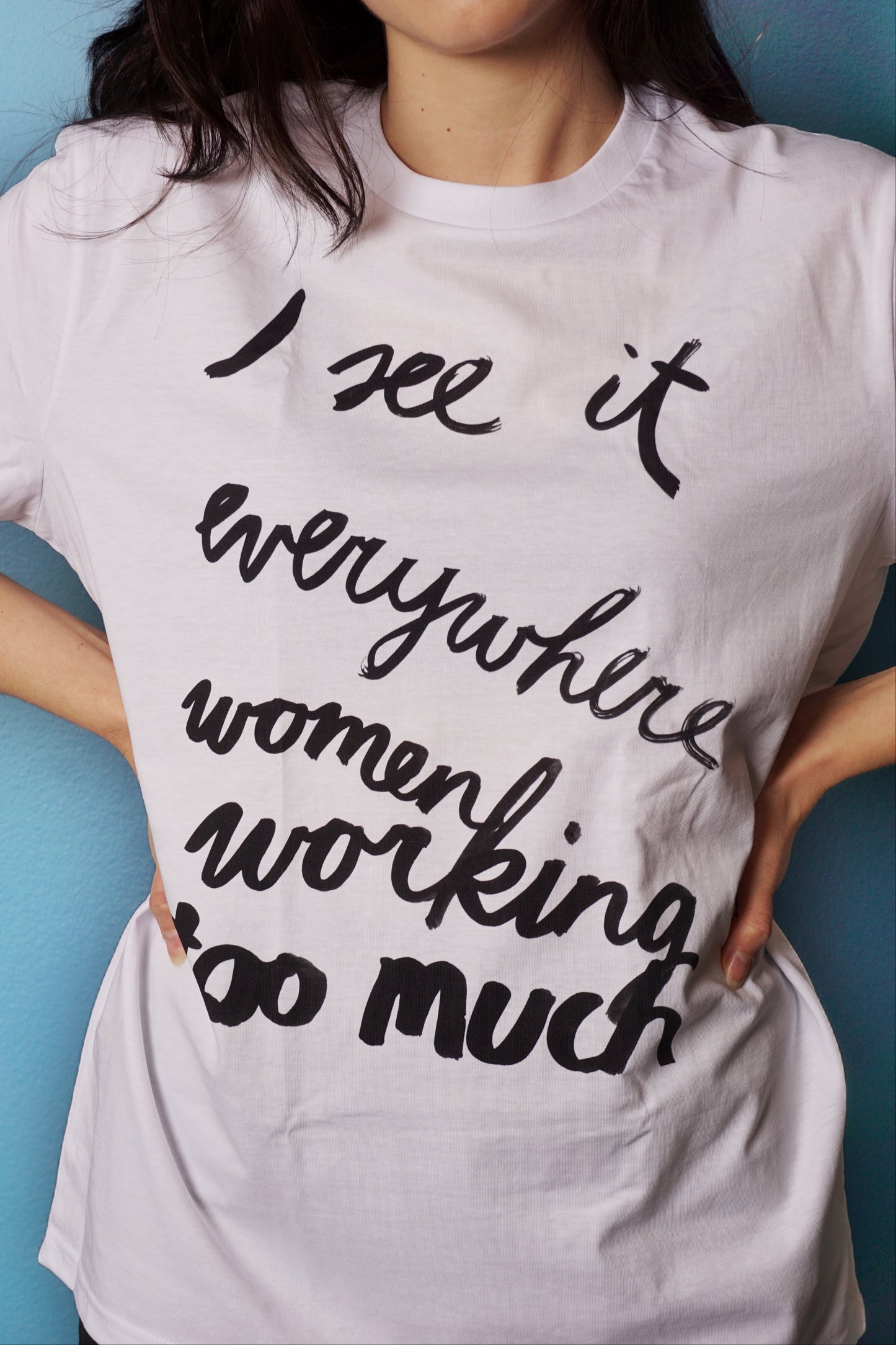 Eva Vēvere. Unisex T-Shirt "I see it everywhere women working too much"