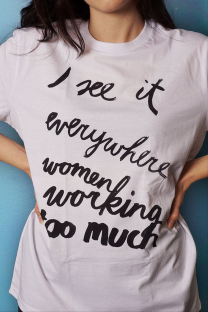 Eva Vēvere. Unisex T-Shirt "I see it everywhere women working too much"